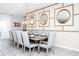 Elegant dining room with a large wooden table and gray chairs at 1986 Summer Dr, Davenport, FL 33897