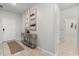 Inviting foyer featuring a decorative table, artwork, and tile flooring at 1986 Summer Dr, Davenport, FL 33897