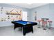 Fun game room with a pool table and bar stools at 1986 Summer Dr, Davenport, FL 33897