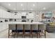 Open kitchen featuring a large island with barstool seating and stainless steel appliances at 1986 Summer Dr, Davenport, FL 33897