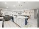 Modern open concept kitchen with a large island, stainless steel appliances, and seating at 1986 Summer Dr, Davenport, FL 33897