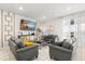 Comfortable living room with stylish decor, tile floors, and ample seating at 1986 Summer Dr, Davenport, FL 33897