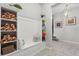 Mudroom features built in shelving, seating, and tiled floors at 1986 Summer Dr, Davenport, FL 33897