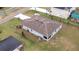 Aerial view of the home with a brown roof and a green backyard at 2016 West Pkwy, Deland, FL 32724