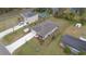 Aerial shot of home highlighting the roof, backyard, and the surrounding neighborhood at 2016 West Pkwy, Deland, FL 32724
