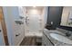 Lovely bathroom featuring a shower with white tile surround and custom shelving for added storage at 2016 West Pkwy, Deland, FL 32724