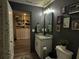 Stylish bathroom with vanity, decorative elements, and adjacent library at 2016 West Pkwy, Deland, FL 32724