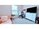 Bedroom featuring a desk, chair, and dresser providing an efficient workspace and storage solutions at 2016 West Pkwy, Deland, FL 32724