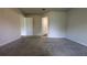 The bedroom features neutral carpeting and access to en-suite bathroom at 2016 West Pkwy, Deland, FL 32724