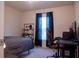 Bedroom with a bed, desk, and gaming chair at 2016 West Pkwy, Deland, FL 32724