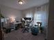 Sunlit home office features a workspace, comfortable chair, and cat tree at 2016 West Pkwy, Deland, FL 32724