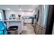Bright open kitchen with stainless steel appliances, granite countertops and white cabinets at 2016 West Pkwy, Deland, FL 32724