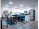 Bright open kitchen with stainless steel appliances, granite countertops and white cabinets adjacent to dining room at 2016 West Pkwy, Deland, FL 32724