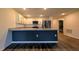The kitchen features a granite countertop, stainless steel appliances, and white cabinets at 2016 West Pkwy, Deland, FL 32724