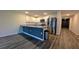 Well-lit kitchen features stainless steel appliances, granite countertops, and modern white cabinetry at 2016 West Pkwy, Deland, FL 32724