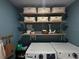 Well-organized laundry room with shelves and stylish storage bins at 2016 West Pkwy, Deland, FL 32724