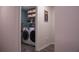 Laundry room with washer, dryer, and shelving for storage at 2016 West Pkwy, Deland, FL 32724