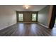 Bright, airy living room with modern flooring and multiple windows at 2016 West Pkwy, Deland, FL 32724