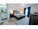 Main bedroom with an ensuite bathroom with stylish vanity and plenty of natural light at 2016 West Pkwy, Deland, FL 32724