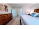 Spacious main bedroom with a comfortable bed, stylish decor, and access to other rooms at 2016 West Pkwy, Deland, FL 32724