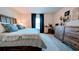 Cozy main bedroom with a comfortable bed, neutral decor, and dresser for storage at 2016 West Pkwy, Deland, FL 32724