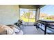 View of a relaxing patio with outdoor furniture, a grill, and a view of the backyard at 2016 West Pkwy, Deland, FL 32724