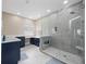 Modern bathroom with double vanity, large shower, and marble floors at 2078 Marsh Hawk Dr, Orlando, FL 32837