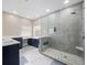 Modern bathroom with double vanity, large shower, and marble floors at 2078 Marsh Hawk Dr, Orlando, FL 32837