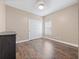 Spacious bedroom with wood-look floors, window blinds and double doors at 2078 Marsh Hawk Dr, Orlando, FL 32837