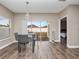 Kitchen dining area with glass table and sliding door to backyard at 2078 Marsh Hawk Dr, Orlando, FL 32837