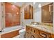 Bathroom features an orange tile shower and granite countertop at 2185 Talman Court, Winter Park, FL 32792