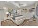 Bright bedroom with a king-size bed and hardwood floors at 2185 Talman Court, Winter Park, FL 32792