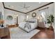 Serene bedroom with hardwood floors and en-suite bathroom at 2185 Talman Court, Winter Park, FL 32792