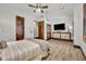 Bedroom with large TV and ceiling fan at 2185 Talman Court, Winter Park, FL 32792