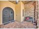 Ornate double doors and tiled entryway with bench at 2185 Talman Court, Winter Park, FL 32792