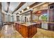 Large kitchen island with granite countertops and stainless steel appliances at 2185 Talman Court, Winter Park, FL 32792