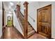 Elegant staircase with tiled steps and wood railing at 2185 Talman Court, Winter Park, FL 32792