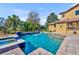 Luxury pool and spa with spacious patio and seating at 2185 Talman Court, Winter Park, FL 32792