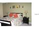 Main bedroom with a bed and nightstands at 2216 Grand Cayman Ct # 1415, Kissimmee, FL 34741