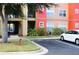 Exterior view of building, showing walkway and parking at 2216 Grand Cayman Ct # 1415, Kissimmee, FL 34741