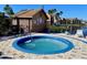 Relaxing hot tub area with adjacent storage shed at 2216 Grand Cayman Ct # 1415, Kissimmee, FL 34741