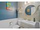 Stylish powder room with gold and marble accents at 264 Celebration Blvd # 264, Celebration, FL 34747