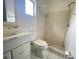 Small bathroom with shower, toilet and vanity at 282 W Summit St, Apopka, FL 32712