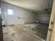 Clean, empty garage with shelving and an overhead door at 282 W Summit St, Apopka, FL 32712