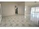 Large living room with tiled floors and access to other rooms at 282 W Summit St, Apopka, FL 32712