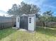 Grey and brown storage shed in backyard at 282 W Summit St, Apopka, FL 32712