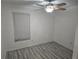 Spacious bedroom with ceiling fan and wood-look flooring at 306 Northlake Dr # 306, Sanford, FL 32773