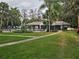 Community pool surrounded by lush landscaping, offering a relaxing oasis at 306 Northlake Dr # 306, Sanford, FL 32773