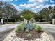 Gated entrance to Stonefield community with landscaping at 3264 River Branch Cir, Kissimmee, FL 34741