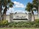 Stonefield community entrance sign with lush landscaping at 3264 River Branch Cir, Kissimmee, FL 34741